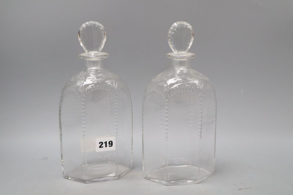 A pair of James Powell Whitefriars hexagonal half-cut glass decanters and stoppers, height 25cm